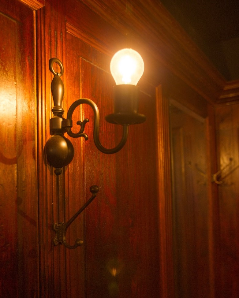 Quirky touches in the decor include a coat hook attached to each light. Photo: Robert Pepper