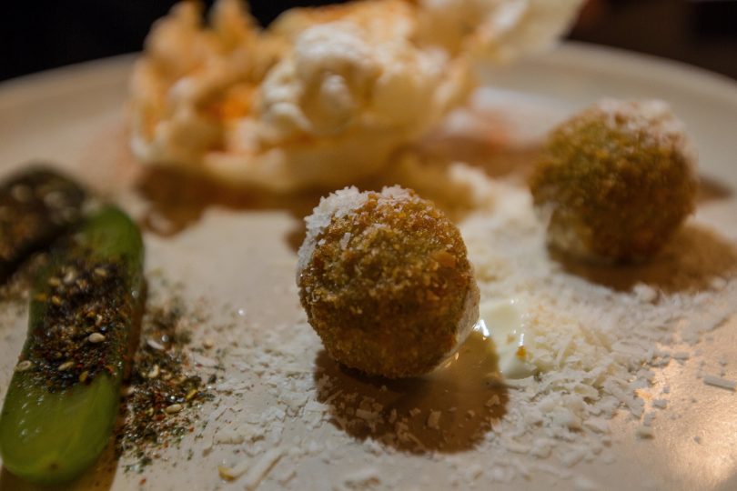 This amuse bouche plate includes Spring Arancini, Jalapeno Pickles topped with an Japanese seasoning, and Beef Scratchings sprinkled with paprika. Photo: Robert Pepper.