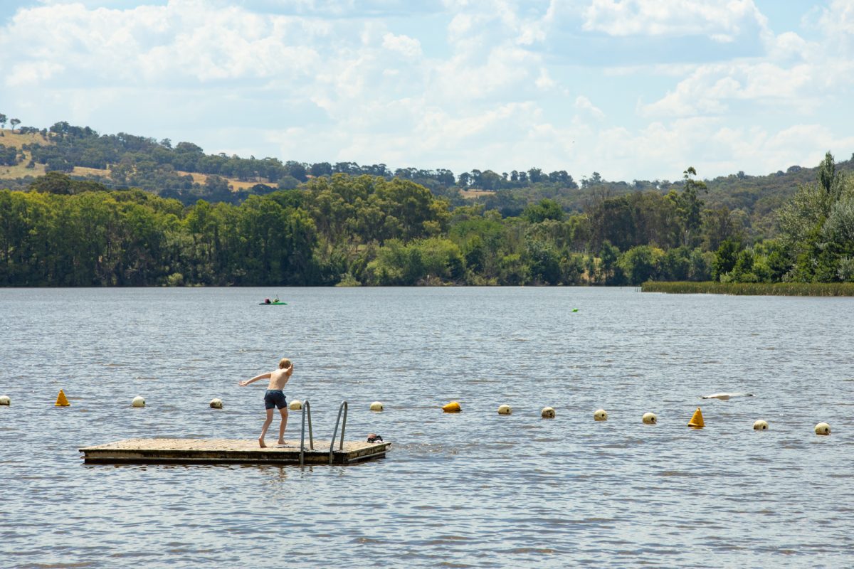 Boy diving into lake