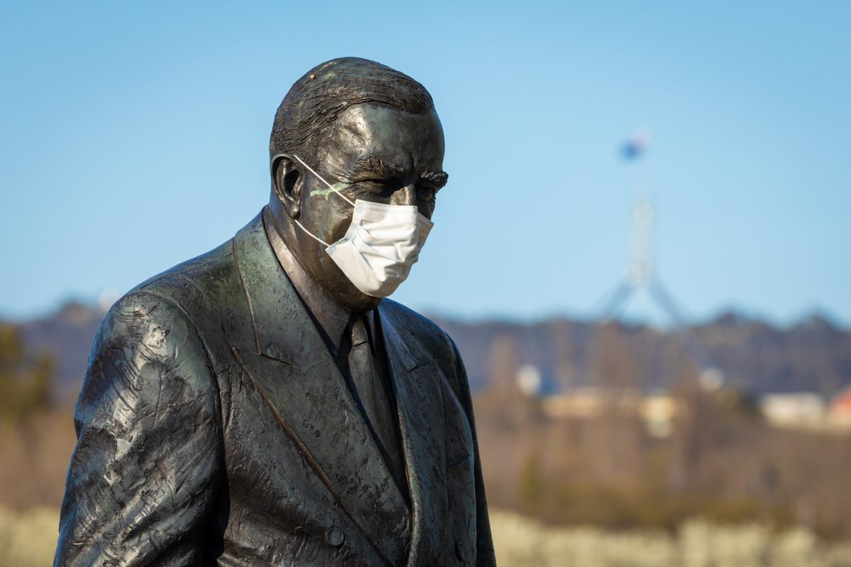Sir Robert Menzies statue wearing a mask