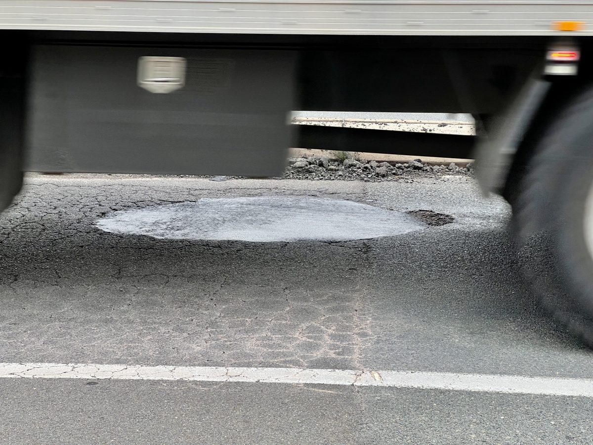 pothole under a moving truck
