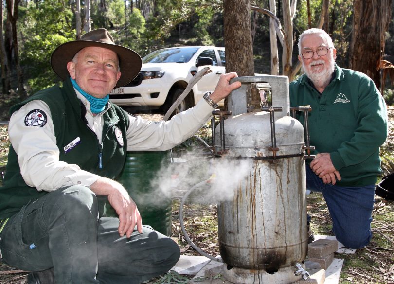 two men with a eucalyptus oil distillery