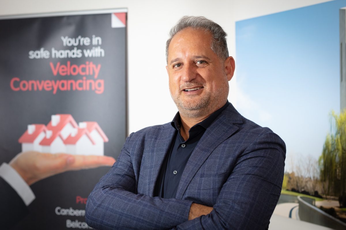 Peter Romano standing with arms crossed