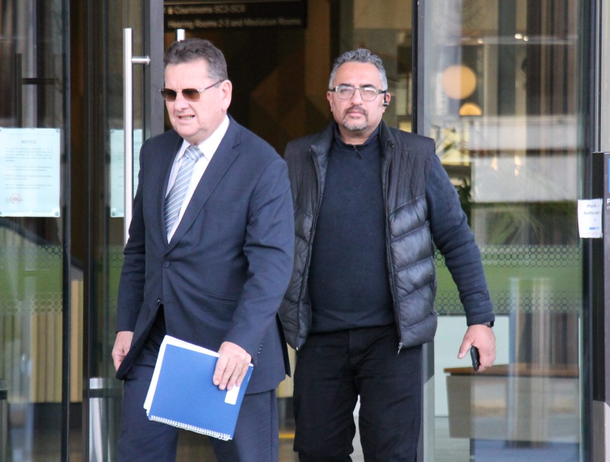 two men leaving court