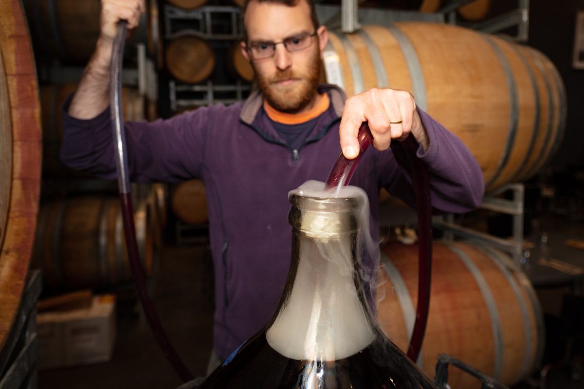 Jacob Law focussed during the winemaking process