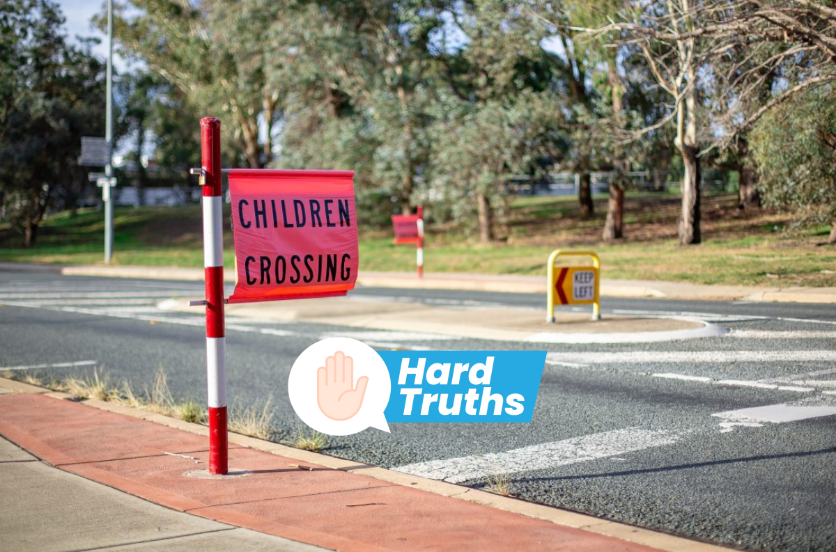 children crossing sign with hard truths logo
