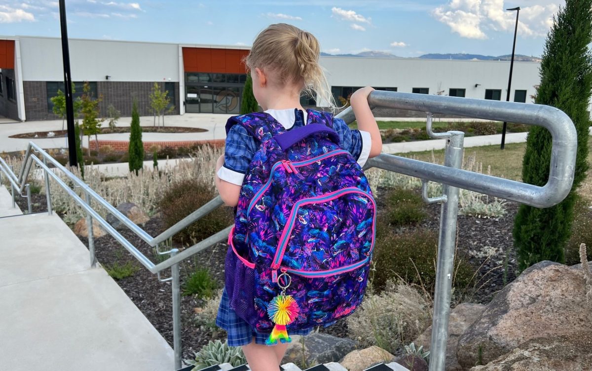 primary school girl with backpack