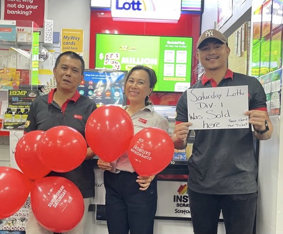 Post office staff celebrate at their store