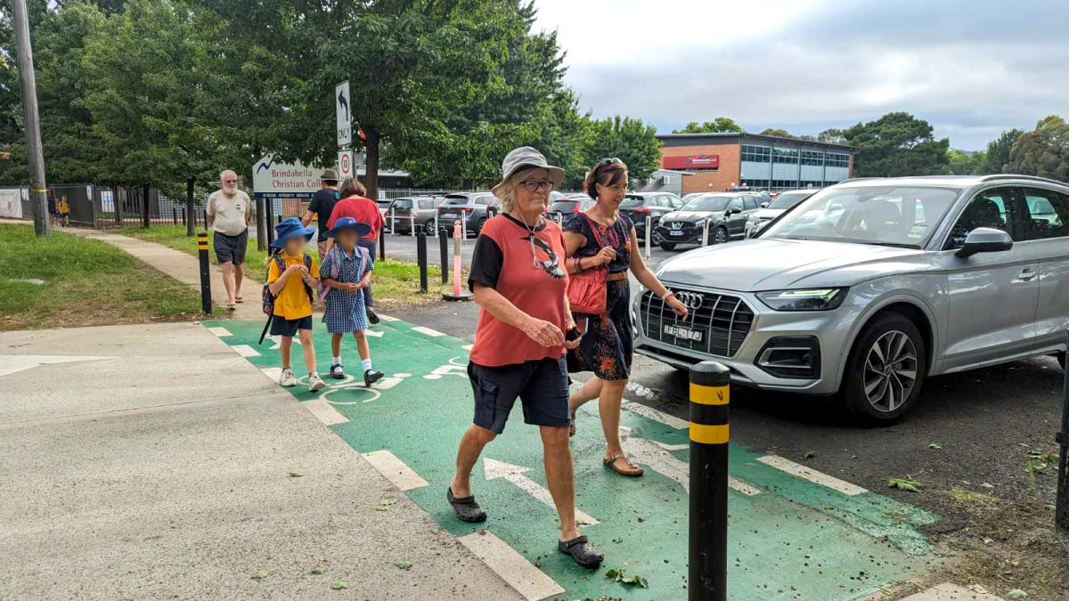 People using a footpath outside Brindabella Chrisitan College