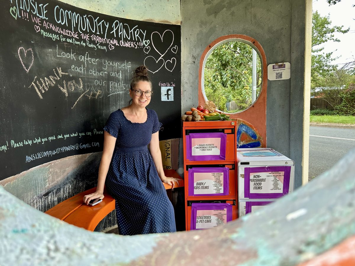 Amy Blain sitting in a bus shelter