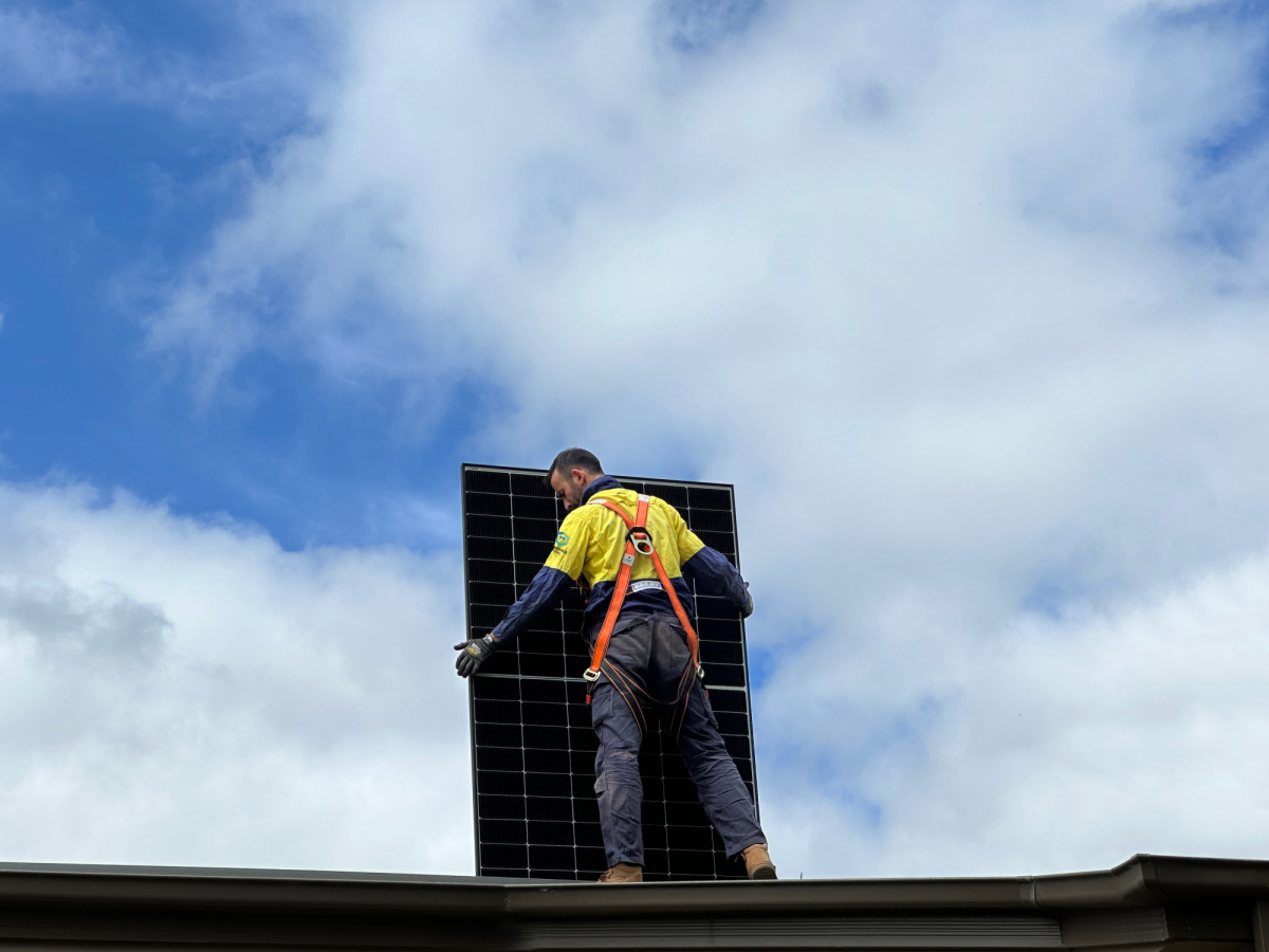 solar technician installing panels