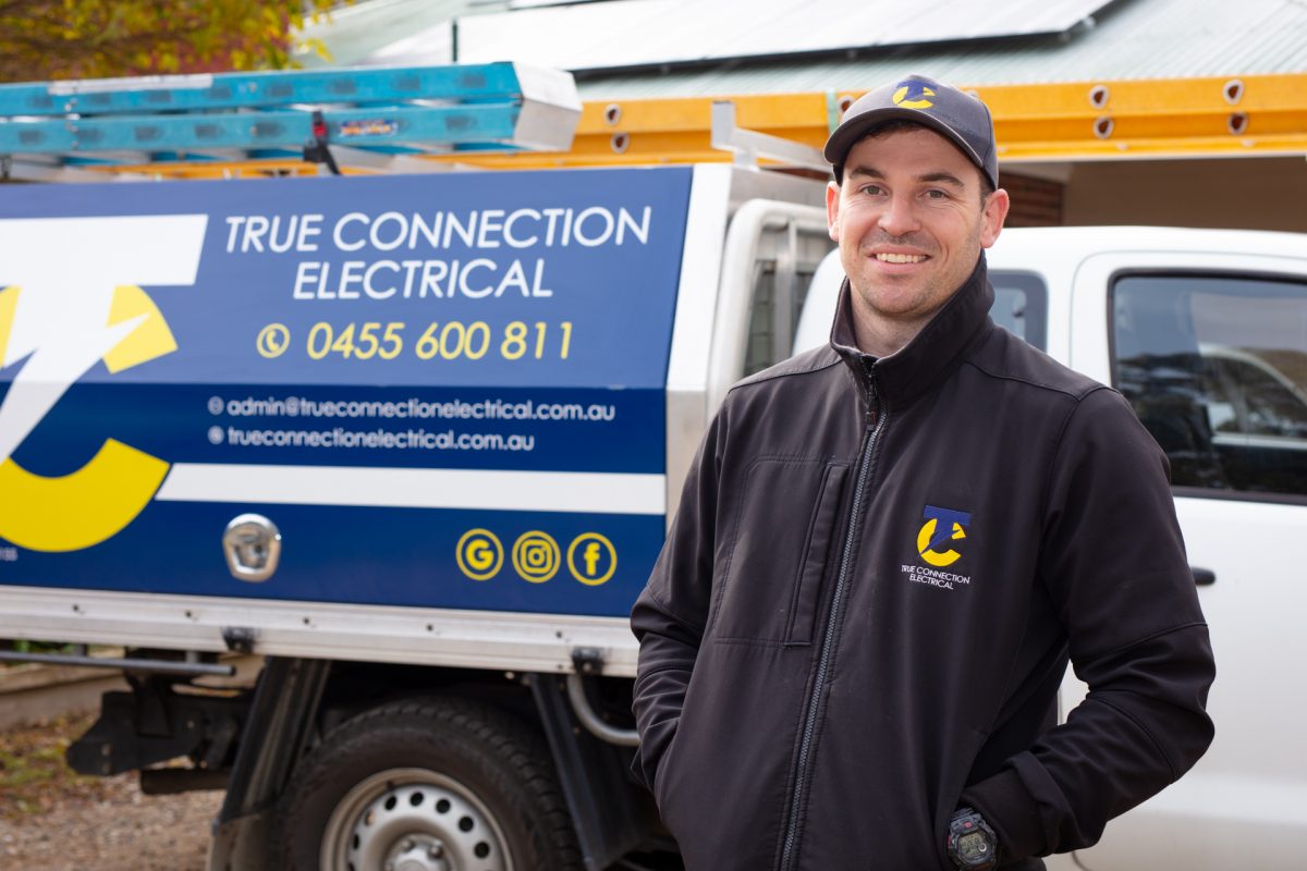 Tim Middleton standing next to a ute