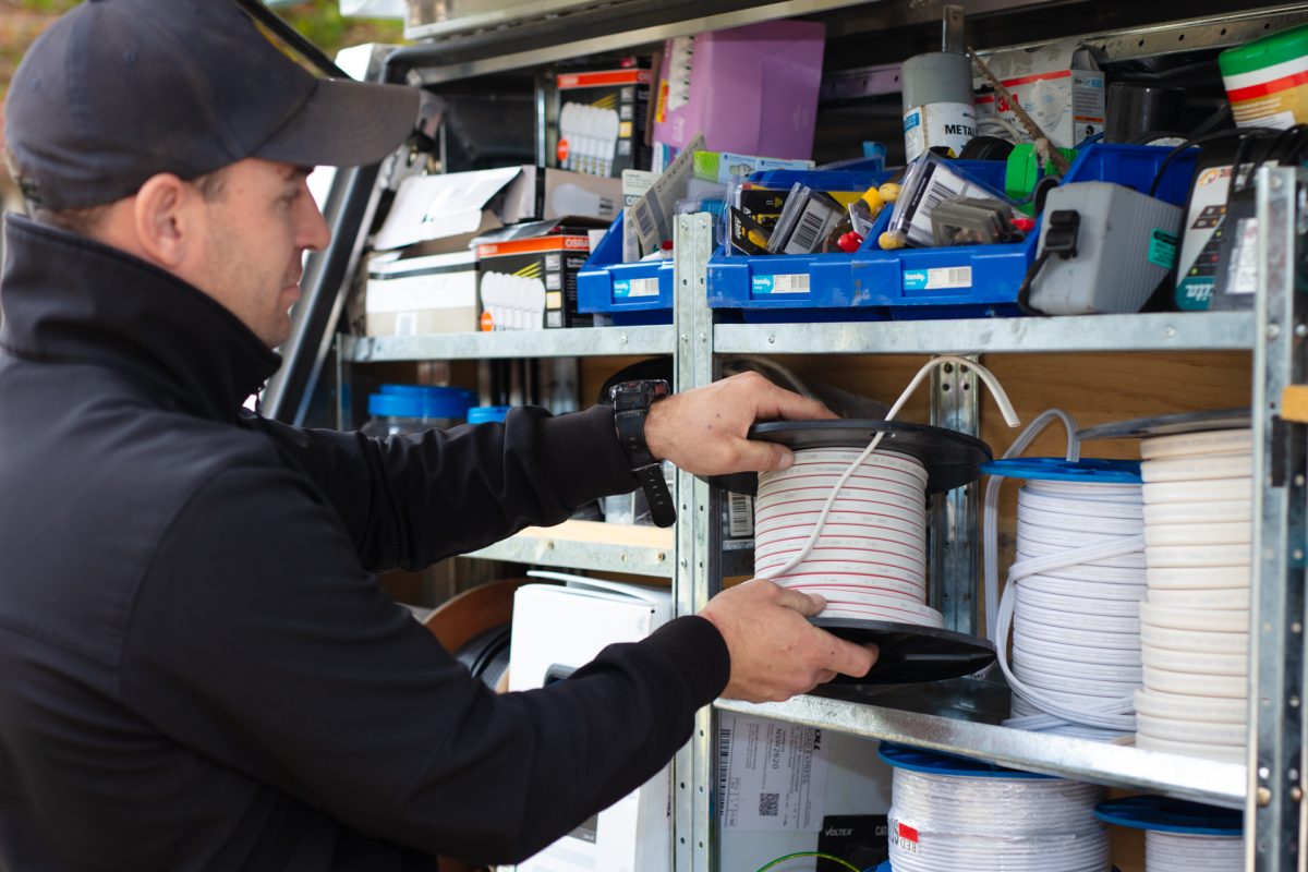 electrician in front of equipment