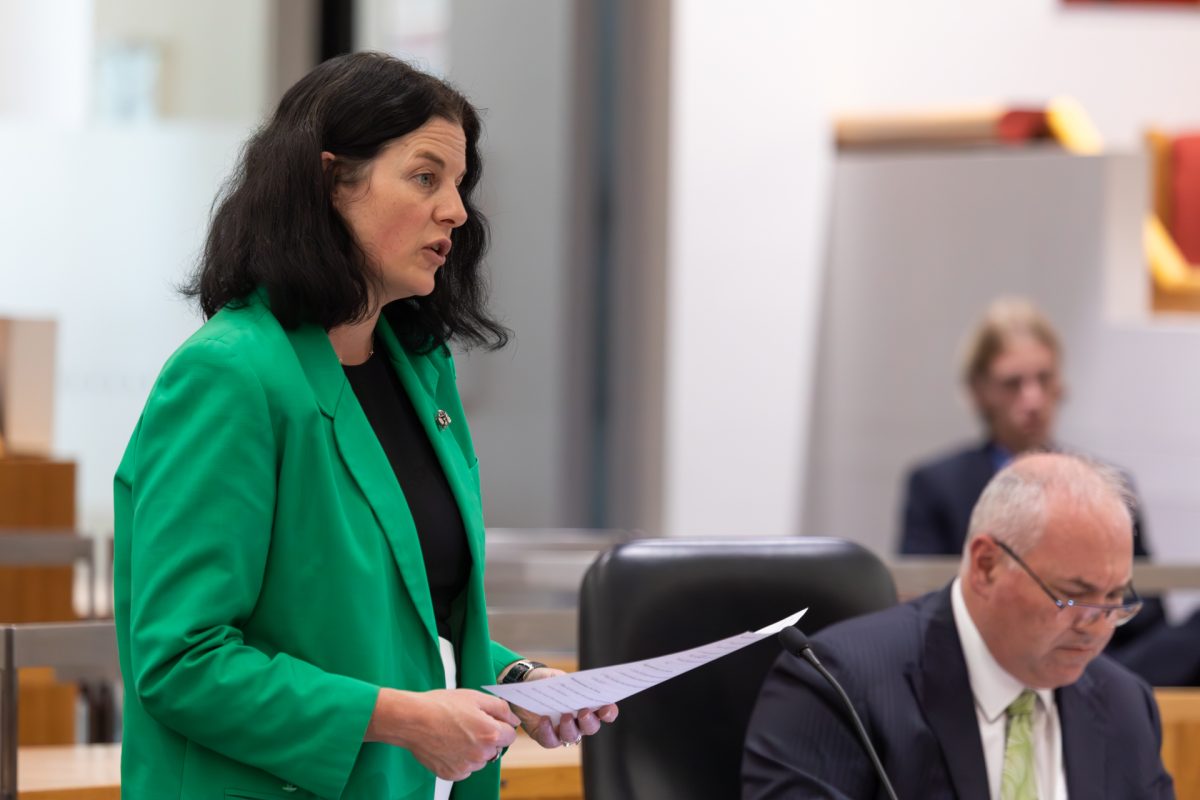 Woman speaking into microphone