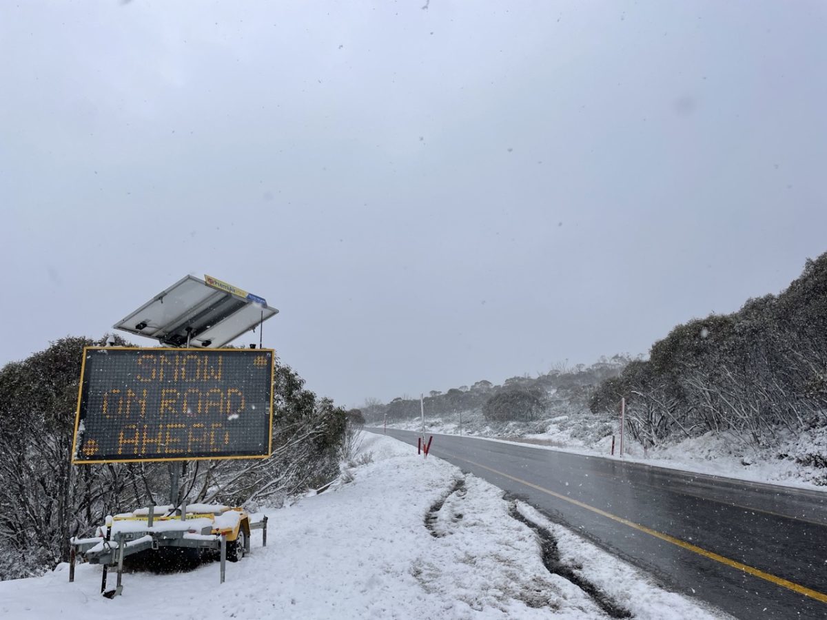 sign next to icy road