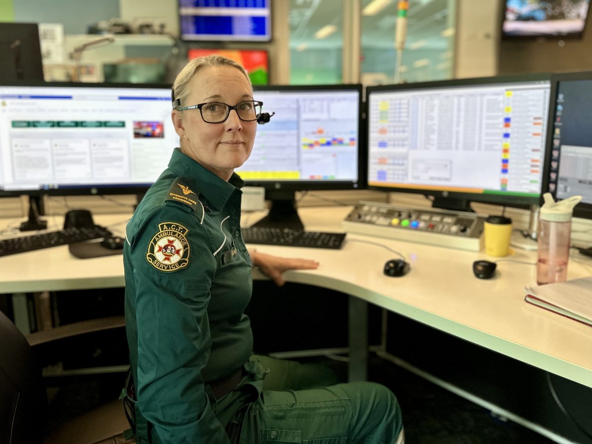 paramedic at her communications centre desk