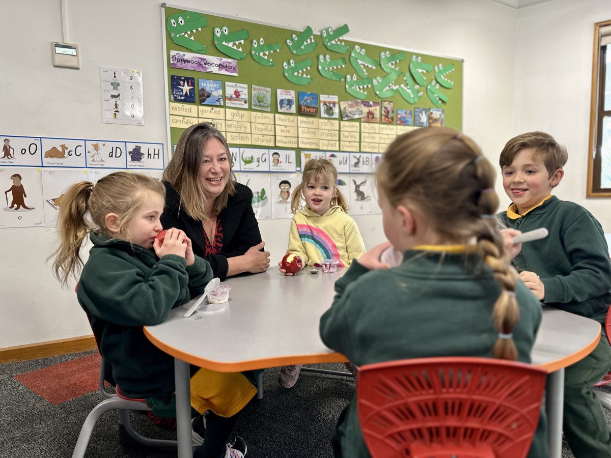 Yvette Berry sitting with children