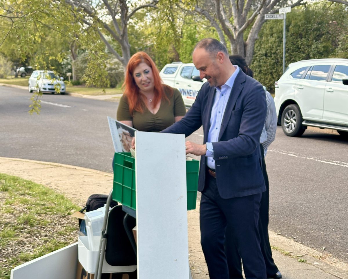 Politicians looking through waste