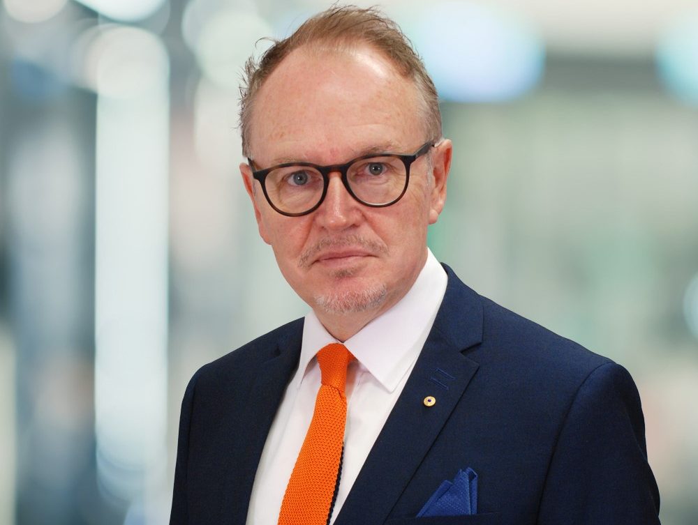 man wearing orange tie