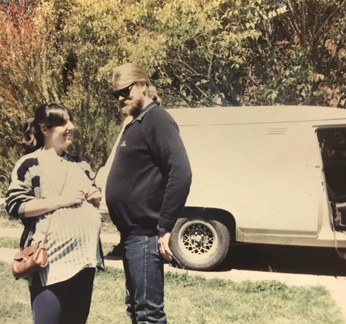 old photo of a man and a woman with a panel van