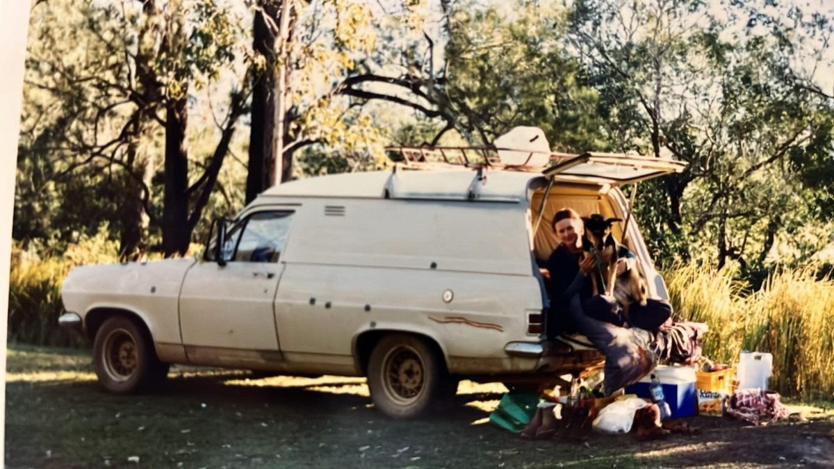 woman camping in a panel van