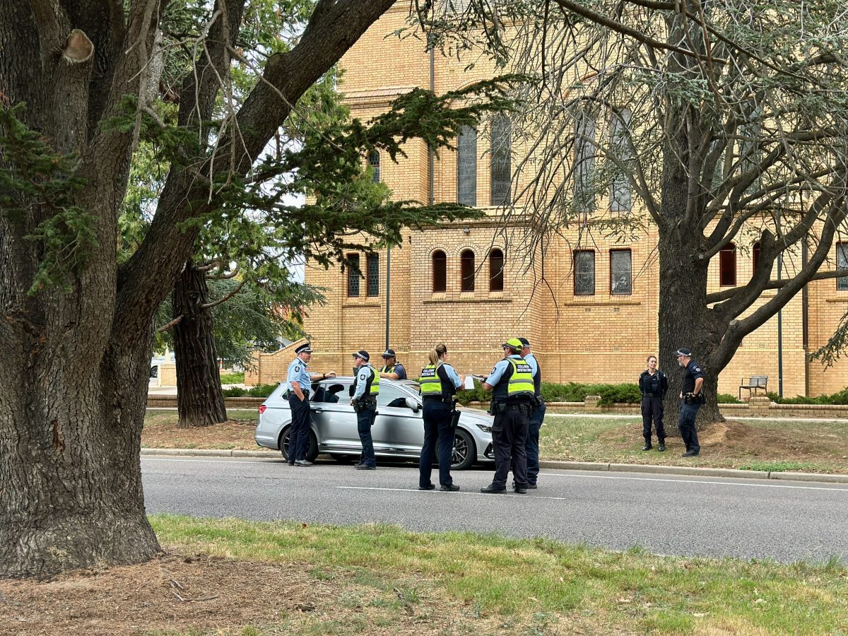 Police officers in uniform outside a church