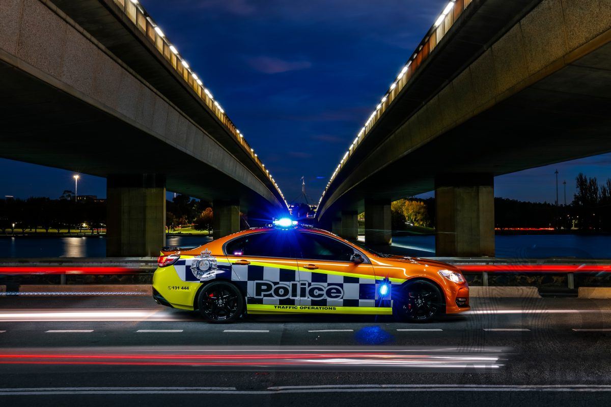 police car on a bridge