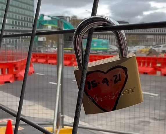 Padlock on construction fencing