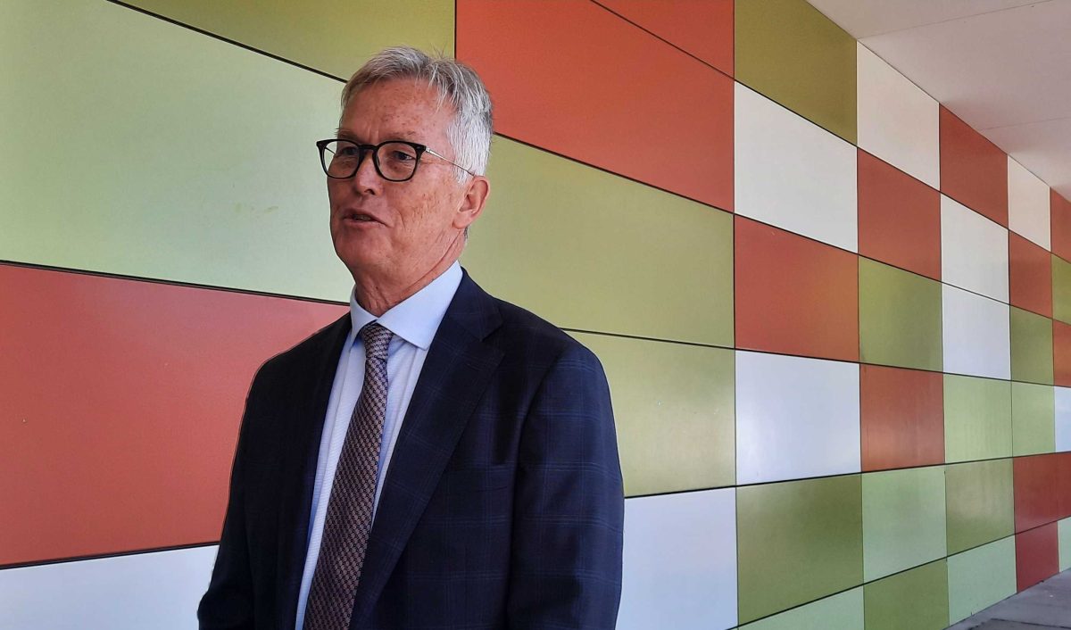 man outside a school