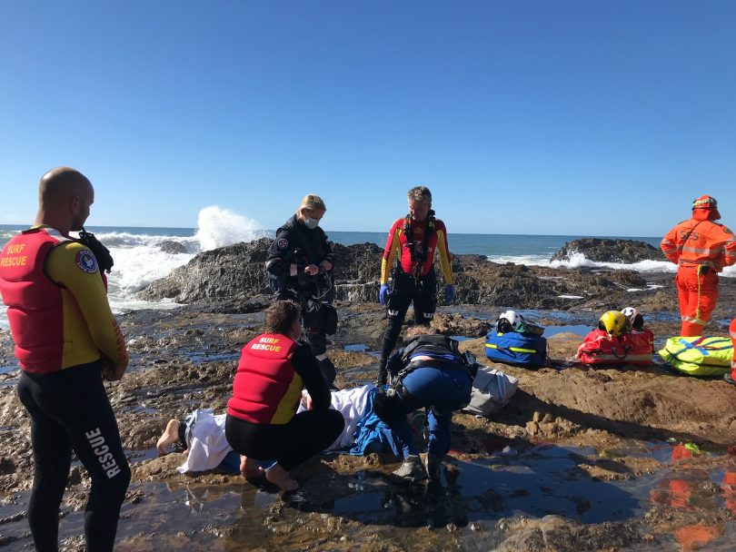 Surf Life Savers provided 90 minutes of first aid to a fisherman washed off rocks at Garden Bay.