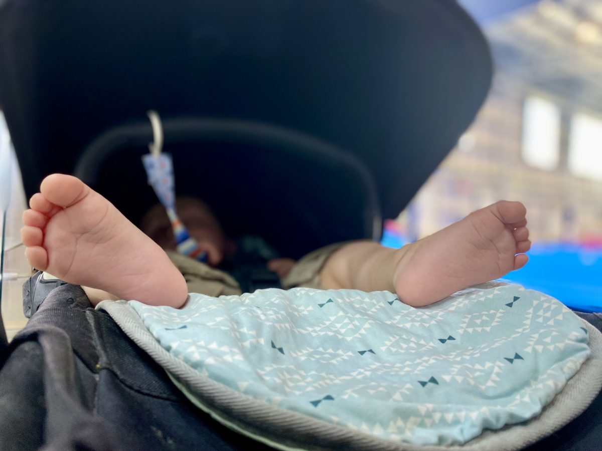 baby feet poking out of pram