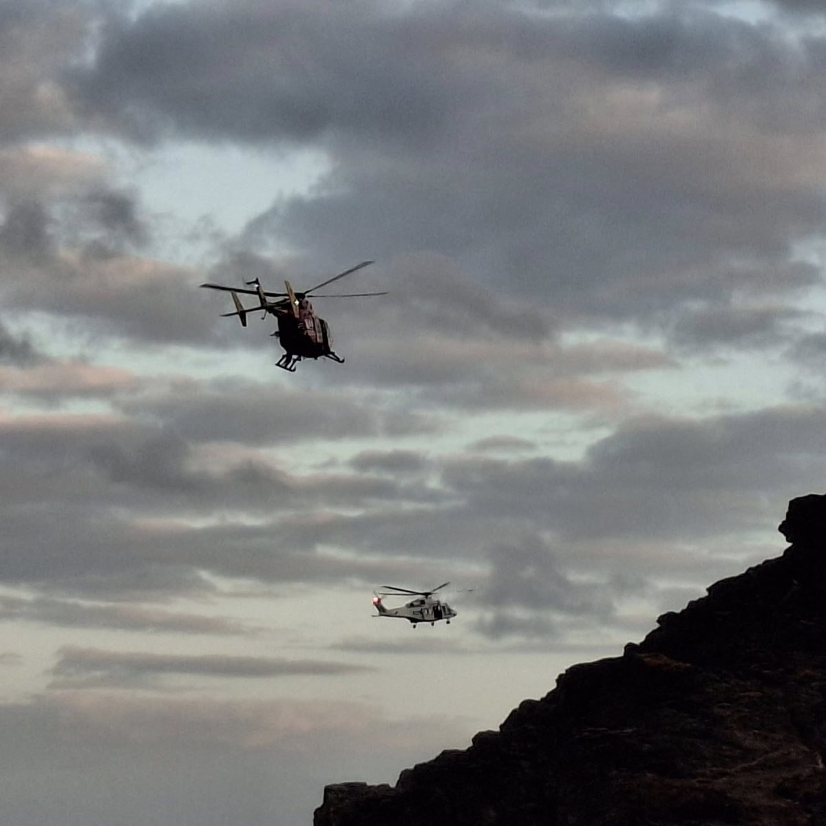 Two helicopters in the sky